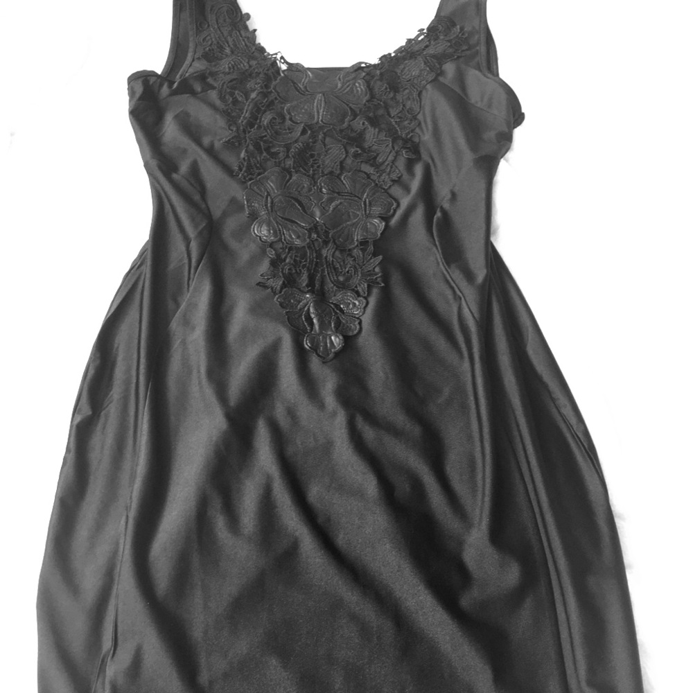 Best black dress! Cascading detailing up bodice.